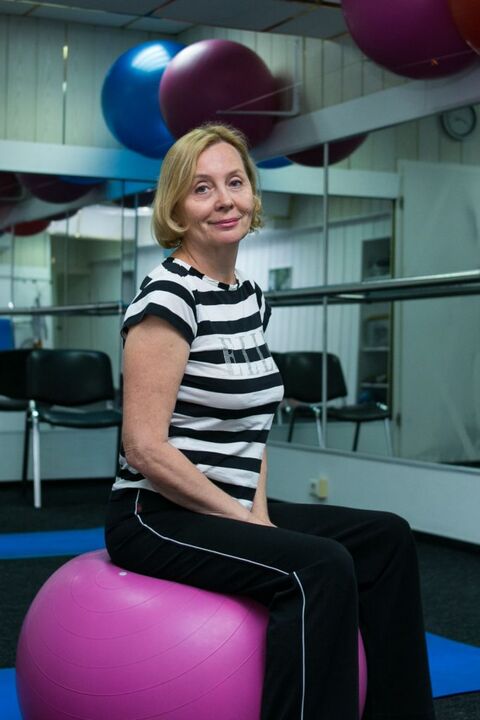 A woman with thoracic osteochondrosis after exercise therapy